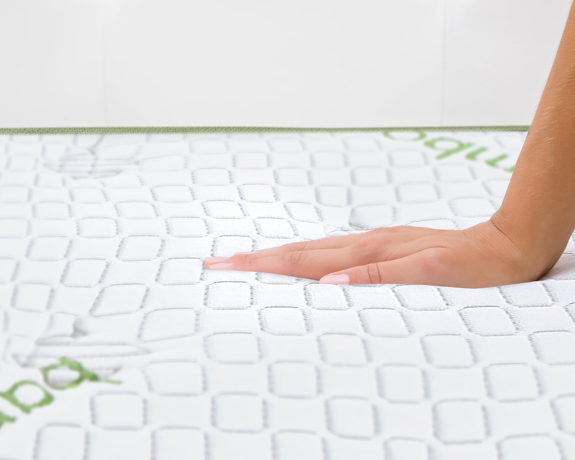 Woman's,Hand,Pressing,On,White,Mattress.,Checking,Hardness,And,Softness.